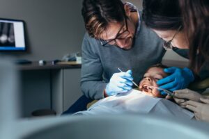young patient getting a tooth extraction for braces